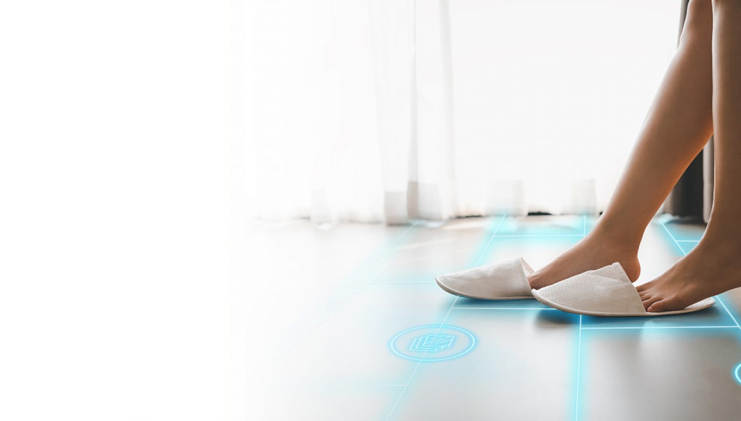 The lower half of a woman sitting down on tiling